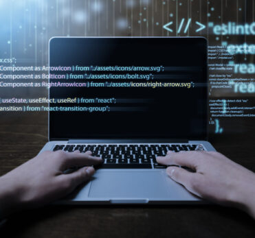 programming-background-with-person-working-with-codes-computer