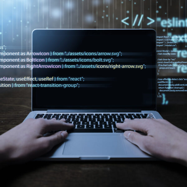 programming-background-with-person-working-with-codes-computer